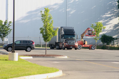 Truck parks in the back awaiting crane