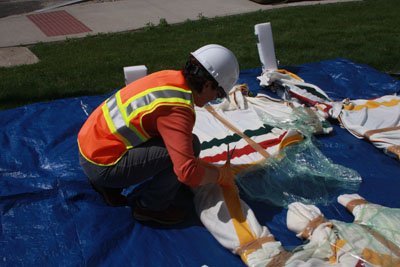 Carla carefully unwrapping the sculpture