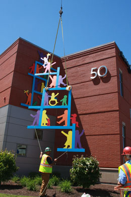 Lifting the South Wall Sculpture to the wall