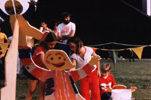 Children painting the Totem in Houston